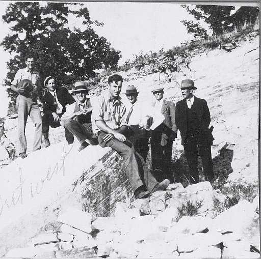 Pearse Hollenbeck (sitting on rock) out west.  Photo studio 